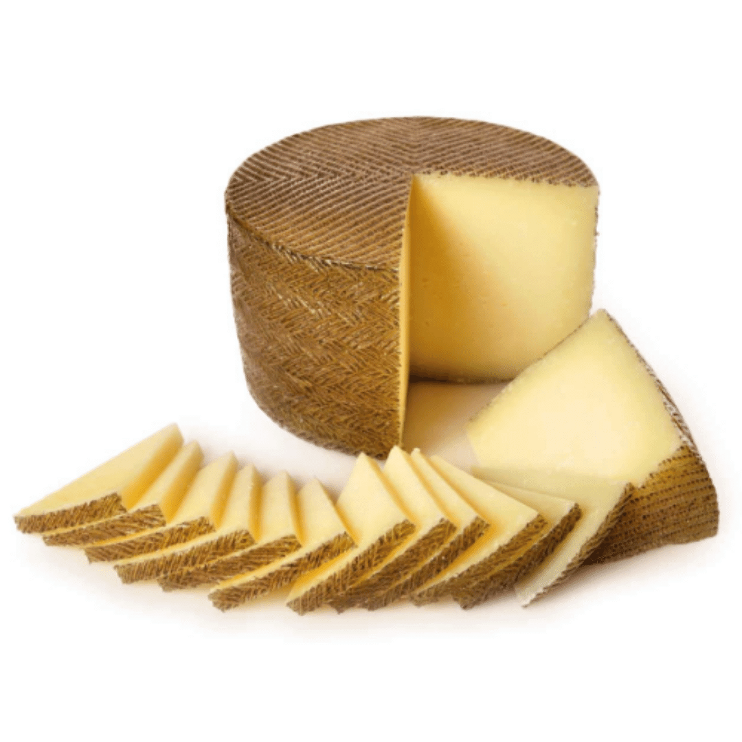 Manchego de Castilla la Mancha (Semicurado con D.O.P.) El Queso Manchego es el queso más emblemático de España, reconocido por su historia, sabor y calidad. Originario de la región de La Mancha, este queso se elabora exclusivamente con leche de oveja de r